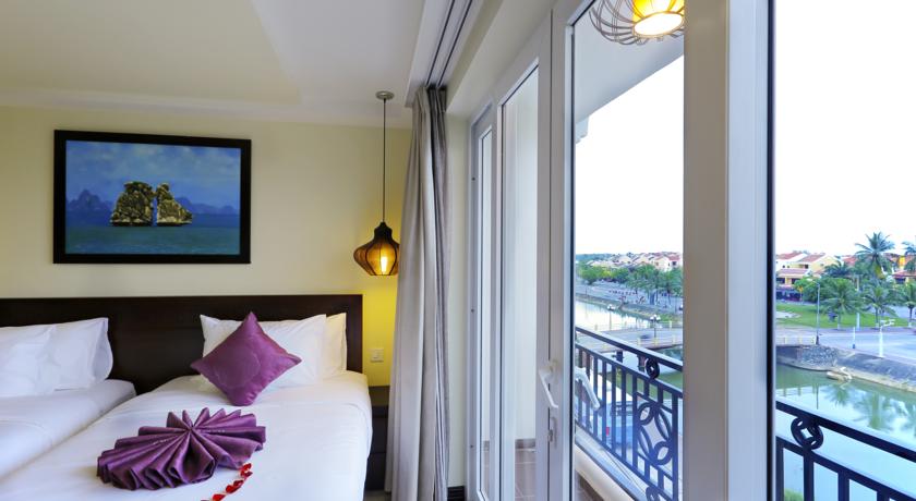 Quarto e vista do River Suites Hotel, em Hoi An, Vietnã | foto: divulgação